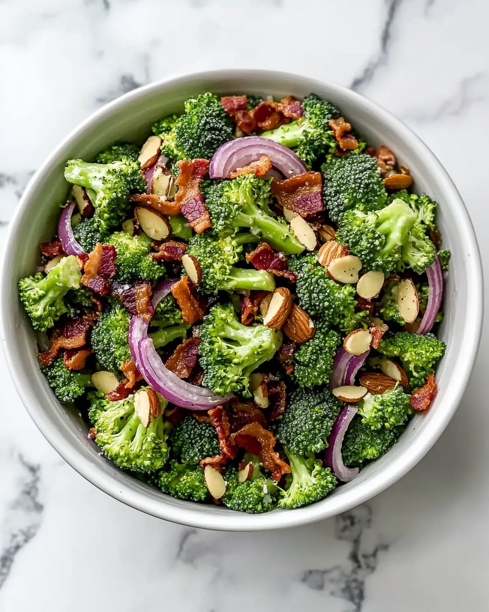 Creamy Broccoli Salad with Bacon, Red Onion, Raisins, and Almonds Recipe - Recipe Image