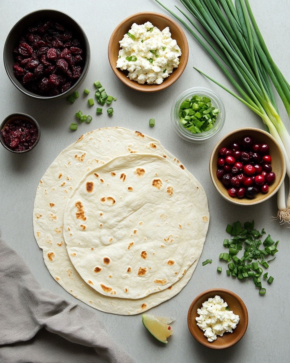 This image shows a Christmas tree shape made from green tortilla roll-ups with white cream cheese and bits of red cranberries inside, arranged in 5 layered rows—5 pieces on the bottom, then 7, 6, 4, and 2 at the top. Small green rosemary sprigs are placed between the roll-ups to look like tree branches, and a yellow star-shaped cheese sits at the top as the tree topper. The whole tree is on a wooden board, with two black forks on the bottom right corner on a white marbled surface. Photo taken with an iphone --ar 4:5 --v 7