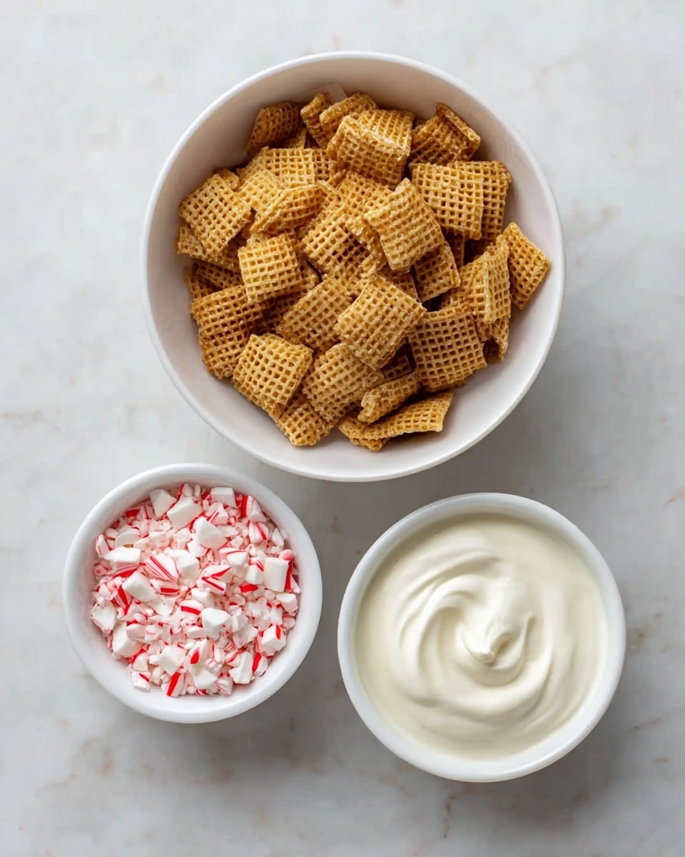 The image shows three white bowls on a white marbled surface. The largest bowl is full of light brown, square-shaped crispy cereal pieces with a grid pattern. Below it, two smaller bowls are placed side by side; the one on the left contains small chunks of crushed red and white peppermint candy, while the bowl on the right holds smooth, creamy white yogurt with a thick texture. photo taken with an iphone --ar 4:5 --v 7
