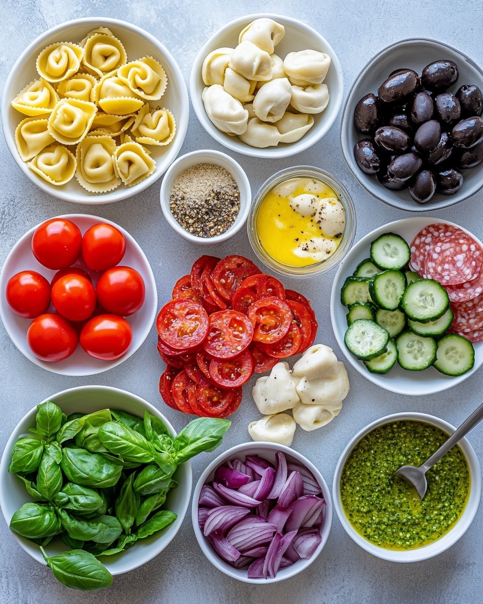 A close-up of a white bowl filled with a colorful pasta salad layered with small pasta shapes that are creamy off-white, bright red cherry tomato halves, dark purple-black olive slices, light green cucumber chunks, thin red onion rings, small pieces of pinkish-red salami, and bits of white cheese, all mixed with chopped green herbs and a light dressing that makes the ingredients shine slightly. A gold fork is lifting a bite showing a mix of the pasta, tomato, olive, cucumber, onion, and salami above the bowl, with another bowl of the same salad blurred in the background, set on a white marbled surface. Photo taken with an iphone --ar 4:5 --v 7