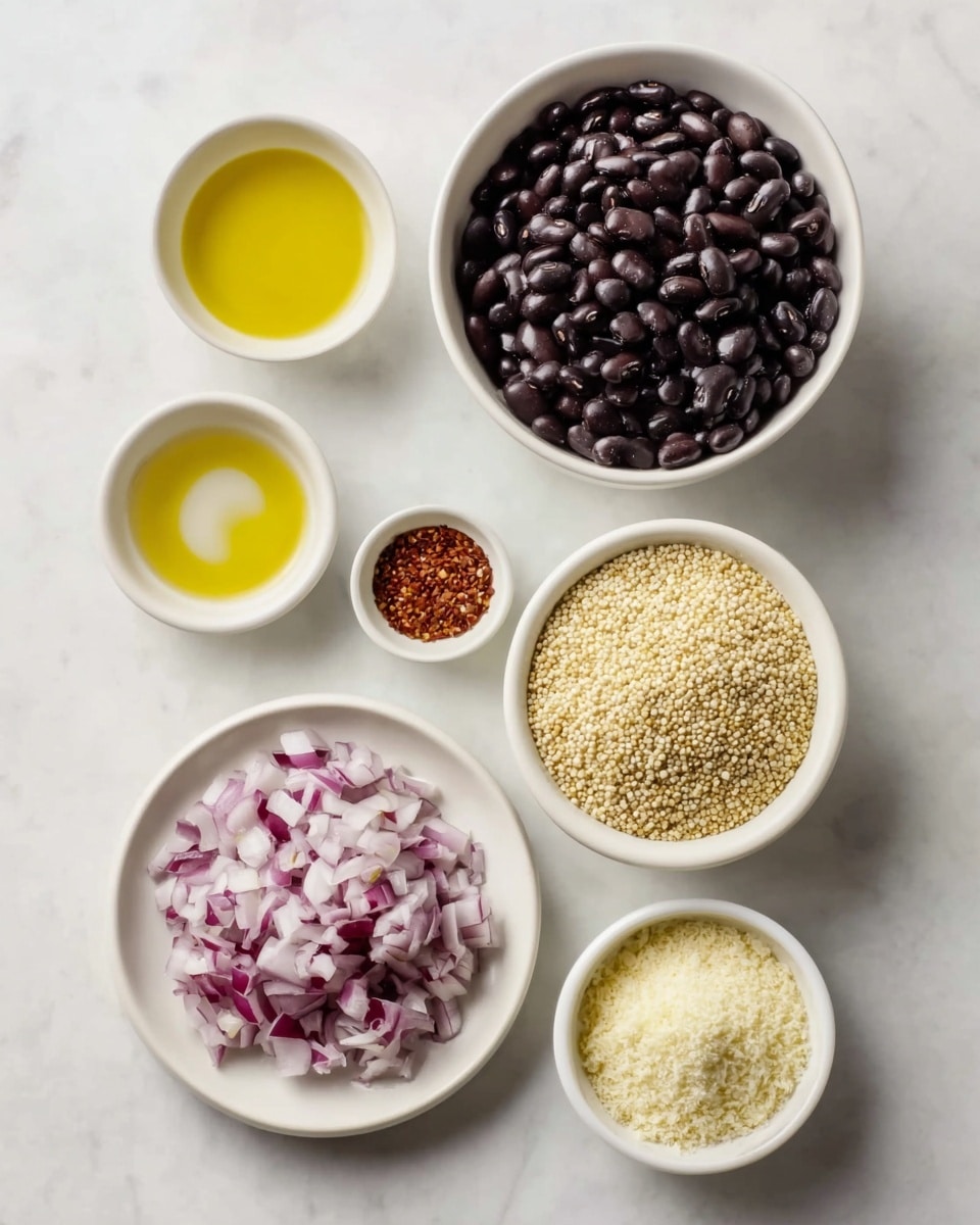 The image shows six white dishes on a white marbled surface, each holding a different ingredient. At the center top, a medium bowl is filled with shiny black beans, dark and smooth in texture. Below it, a bowl on the right contains light yellow quinoa grains with a rough texture, and next to it, a smaller bowl with pale yellow powdered cheese or a similar grated ingredient. On the left side, one white plate holds finely chopped red onions with a mix of white and purple bits, while two small bowls above and below it contain yellow olive oil and a red spice with flax seeds, respectively. The arrangement is clean and orderly. photo taken with an iphone --ar 4:5 --v 7