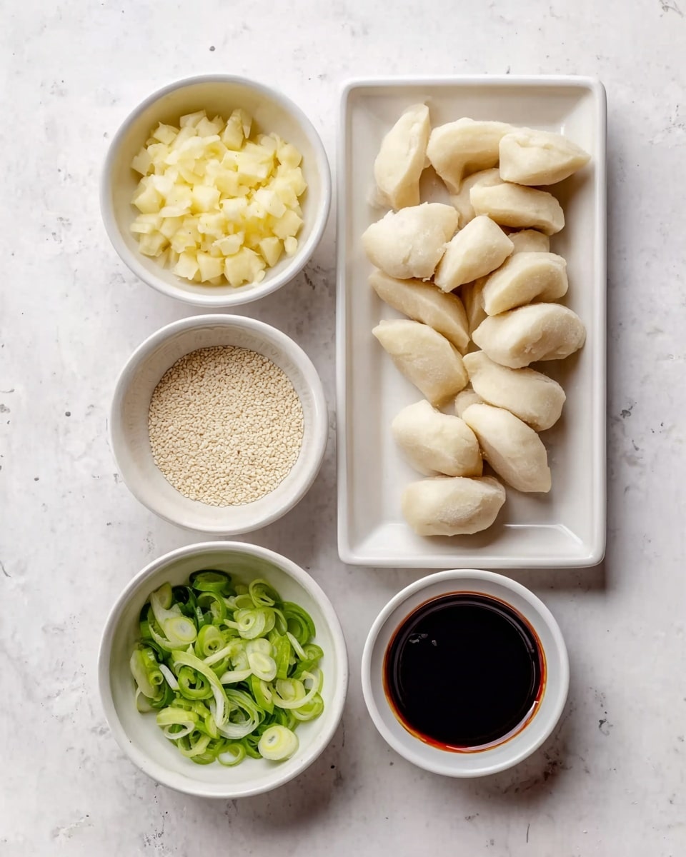The image shows five white bowls on a white marbled surface, each with a different ingredient. On the right side, a rectangular white plate holds about a dozen off-white pieces of shaped dough or dumplings with a smooth, slightly shiny texture. To the left, four small round white bowls are arranged vertically: the top bowl is filled with chopped pale yellow pieces that look like garlic or potatoes, below it a bowl of small white sesame seeds, next is a bowl of thinly sliced green onions with a fresh green color, and at the bottom a bowl filled with dark brown soy sauce with a glossy surface. The photo taken with an iphone --ar 4:5 --v 7