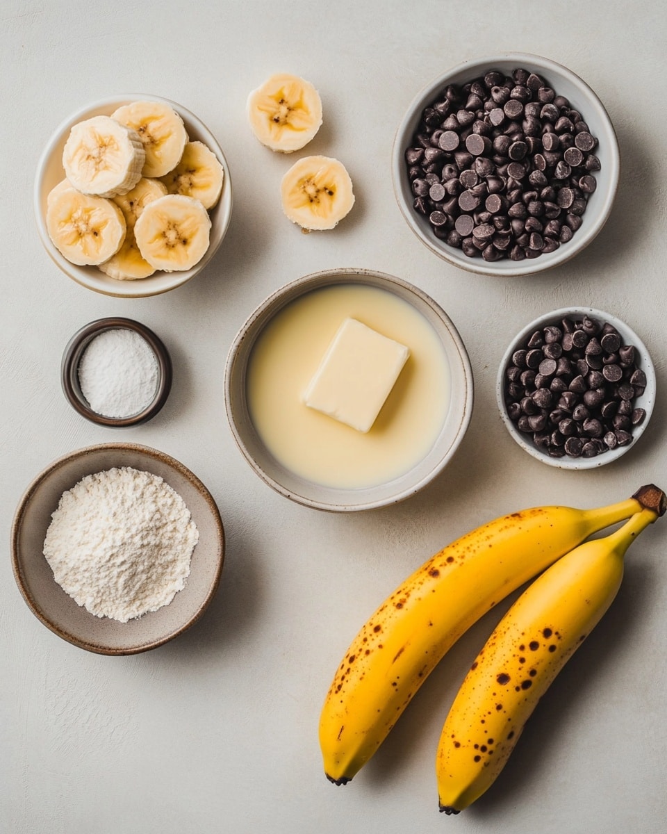 A rectangular baked banana bread loaf with a golden brown crust sits on a cooling rack. The top layer is studded with scattered chocolate chips that are partially melted, adding texture and dark spots on the bread's surface. In the blurred background, there is a white plate with a small blue bowl filled with more chocolate chips and a spoon resting on the plate, all set on a white marbled textured surface. Photo taken with an iphone --ar 4:5 --v 7