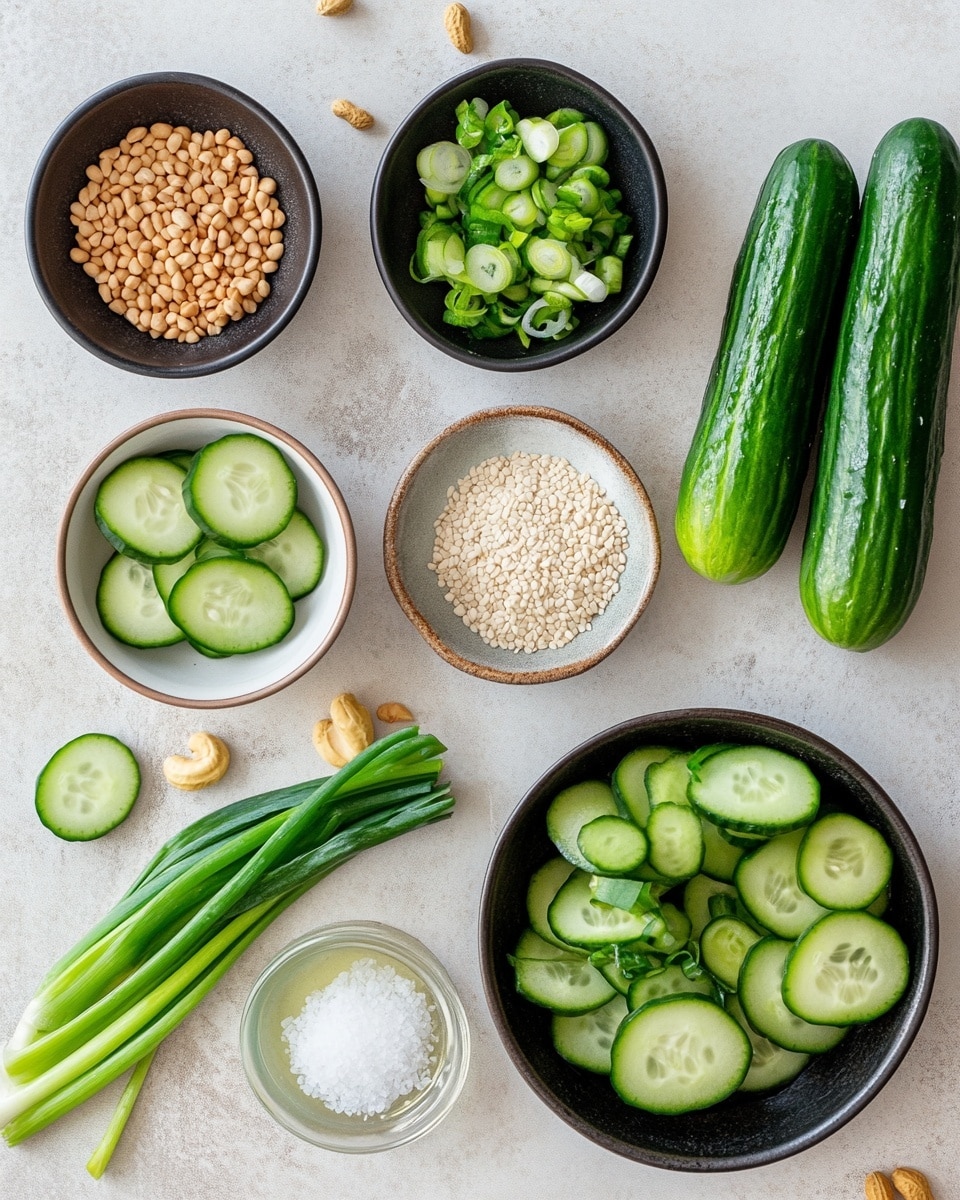 A close-up view of a white bowl filled with thin green cucumber slices coated in a shiny, spicy sauce with red chili flakes and white sesame seeds sprinkled on top. The cucumbers are soaked in a light brown sauce at the bottom of the bowl. A pair of wooden chopsticks held by a woman's hand is lifting several slices of the cucumber, showing the glossy texture and the seeds clearly. The background is a white marbled texture. photo taken with an iphone --ar 4:5 --v 7
