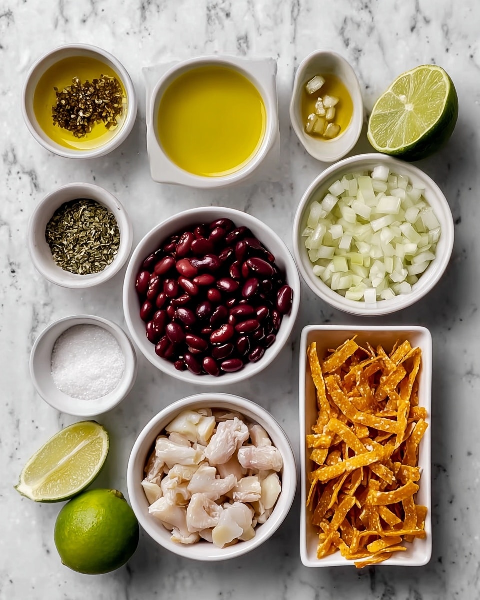 The image shows a top view of various ingredients neatly arranged on a white marbled surface. There are nine white bowls and one white rectangular dish holding the ingredients: a bowl with yellow oil, a small bowl with dried herbs, a bowl with white beans, a bowl with dark red beans, a bowl with chopped white onions, a bowl with green dried herbs, a bowl with light golden oil, a bowl with coarse white salt, a bowl with cooked white meat pieces, and a rectangular dish filled with orange crunchy strips. Two limes are also placed on the surface, one whole and one cut in half showing a fresh green inside. The colors and textures are clearly visible, and everything is neatly arranged in a clean and organized way, photo taken with an iphone --ar 4:5 --v 7
