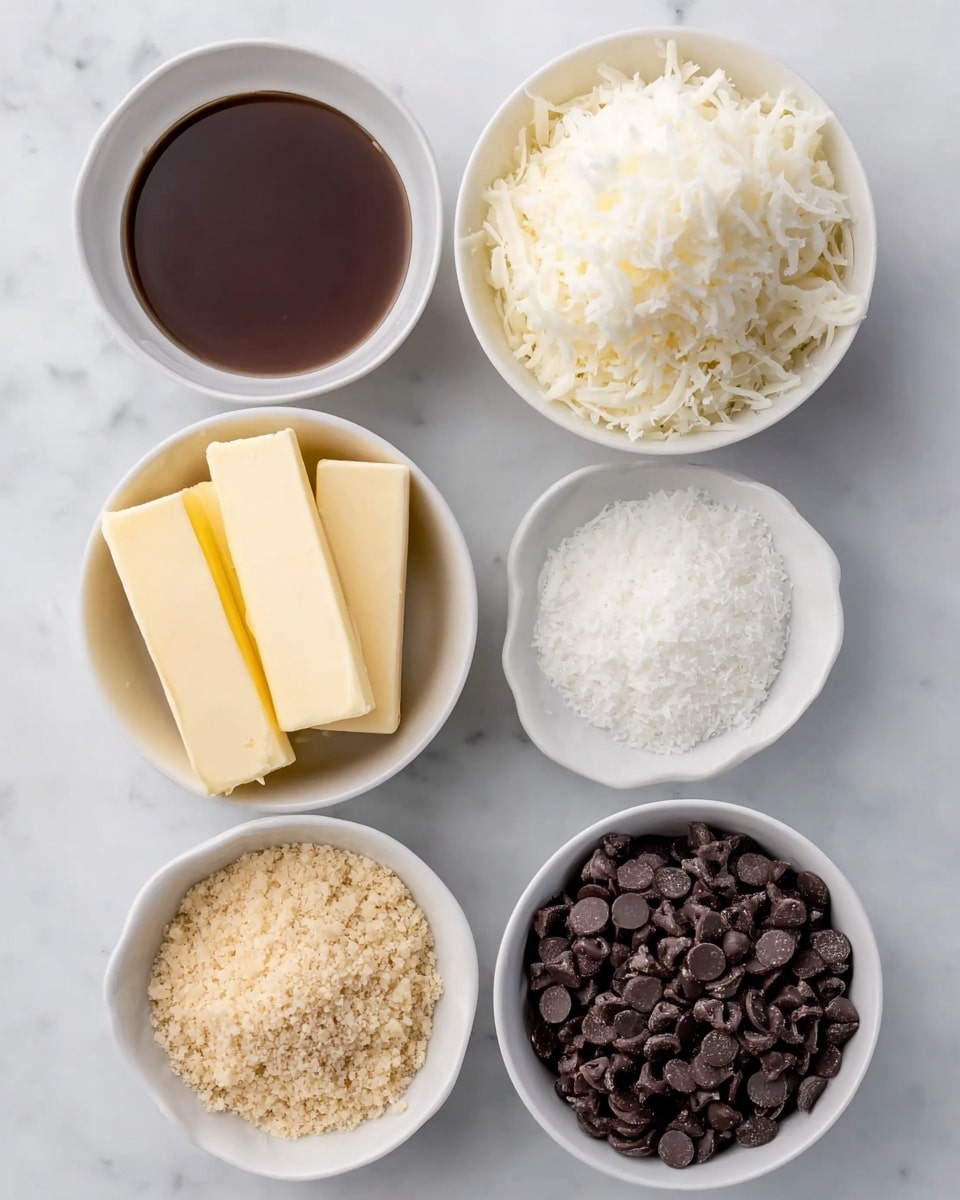The image shows six white bowls arranged neatly on a white marbled surface. The top left bowl holds a dark brown liquid with a smooth texture. Next to it on the right is a bowl filled with a fluffy, white, shredded ingredient forming a mound that spills slightly over the edge. Below the dark liquid bowl is a bowl with three rectangular sticks of pale yellow butter stacked casually. To the right of the butter is a small bowl filled with fine white flakes that look light and airy. At the bottom left is a bowl containing a light brown crumbly ingredient with a grainy texture. The last bowl, at the bottom right, is filled with dark brown chocolate chips densely packed and slightly shiny. All bowls are uniform in style and set symmetrically. photo taken with an iphone --ar 4:5 --v 7