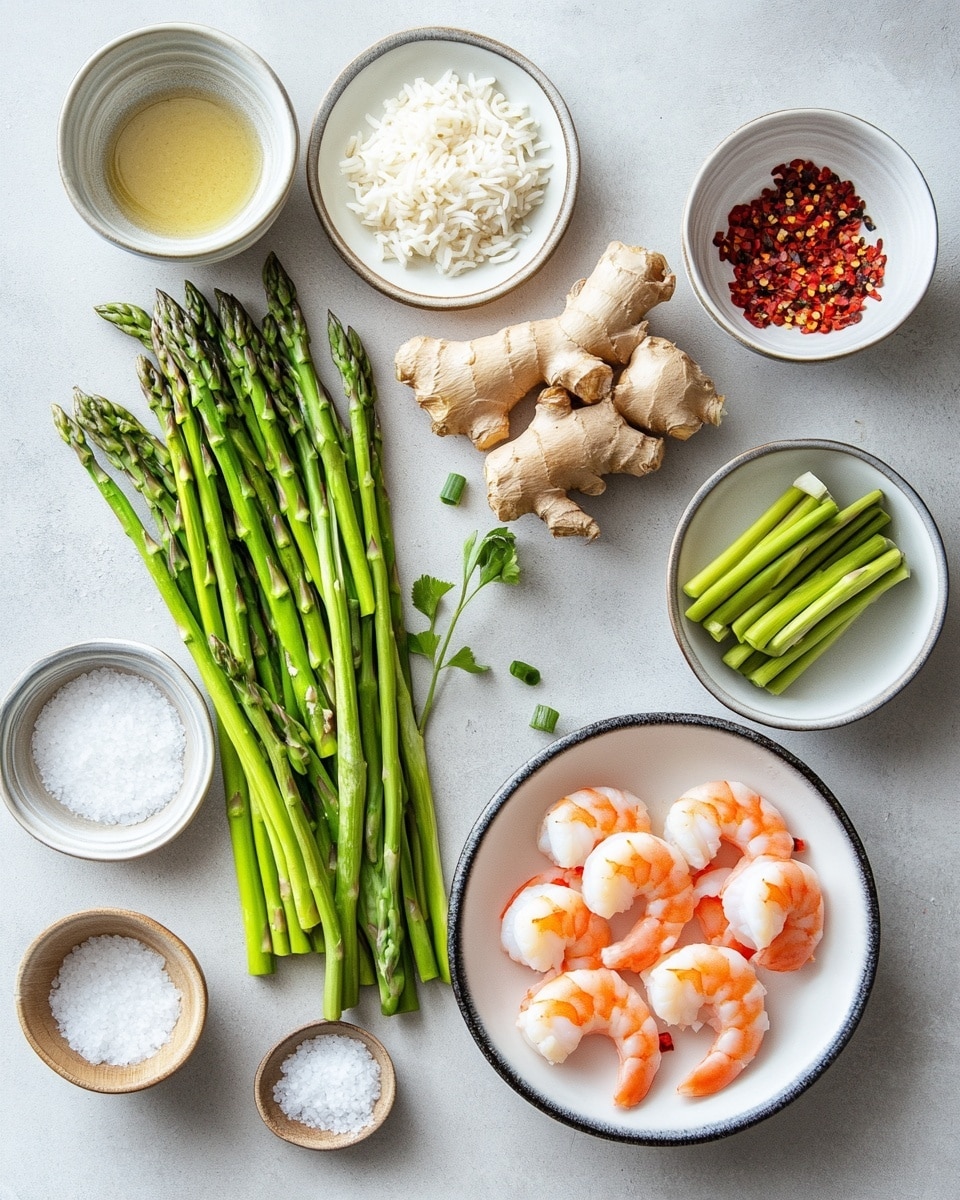 A white round plate holds a dish with two main layers: the bottom layer consists of bright green asparagus stalks cut into smaller sections, and on top are several orange-pink cooked shrimp curled in a crescent shape. The shrimp and asparagus are lightly covered in a shiny brown sauce, and the dish is sprinkled with small white sesame seeds for texture. The plate rests on a white marbled surface. photo taken with an iphone --ar 4:5 --v 7