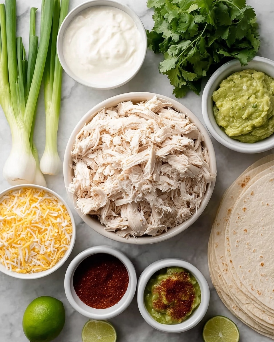 The image shows a top view of several white bowls and a stack of white tortillas on a white marbled surface. In the center is a large white bowl filled with shredded light beige chicken. To the top left of it, there are fresh green onions with white bulbs, and nearby a white bowl with thick white sour cream. To the right of the chicken bowl is a bunch of fresh green cilantro and half a lime with bright green flesh. Below the chicken are three smaller white bowls: one filled with shredded pale yellow and white cheese, one with a chunky green guacamole, and two separate bowls filled with dark red spices. A stack of white tortillas is placed to the right of the bowls. The photo taken with an iphone --ar 4:5 --v 7