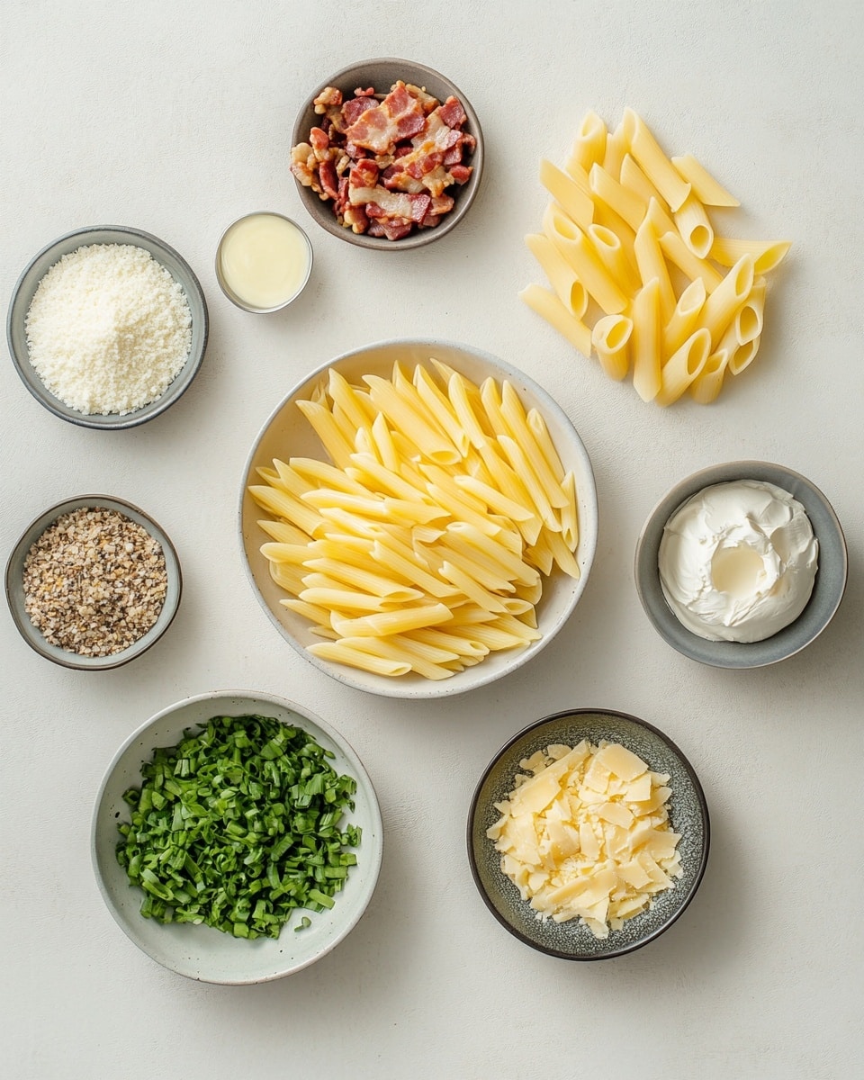 The image shows a close-up of a black pan filled with creamy yellow penne pasta mixed with pieces of grilled white chicken that have golden brown edges. The penne pasta is fully coated in a light creamy sauce with a smooth texture. The dish is sprinkled with small bits of fresh green parsley on top for color contrast. A wooden spoon is stirring the pasta and chicken mixture in the pan. The background has some out-of-focus green herbs and a white marbled surface below the pan. photo taken with an iphone --ar 4:5 --v 7