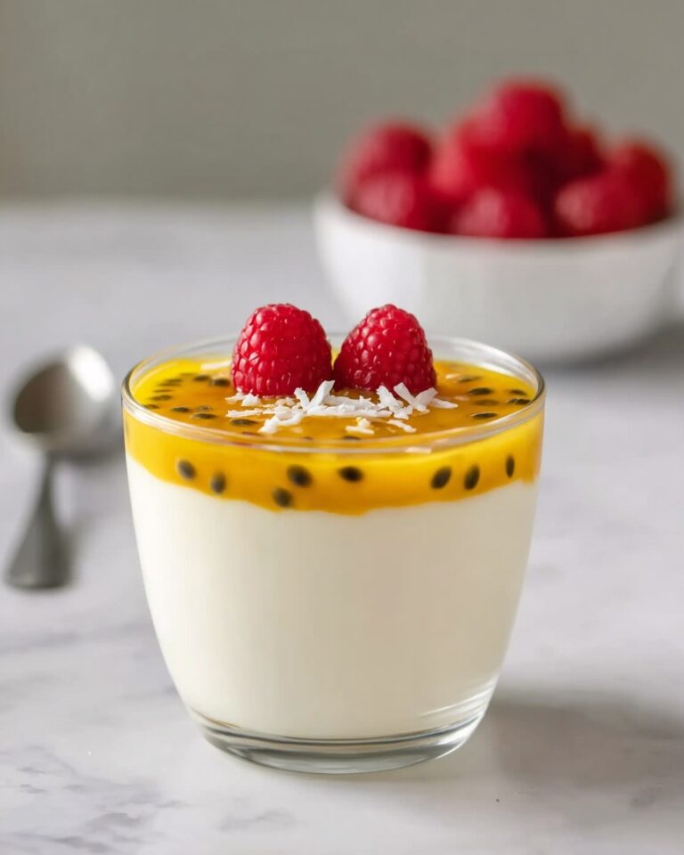 Passionfruit Panna Cotta with Whipped Cream, Raspberries, and Coconut Shavings Recipe