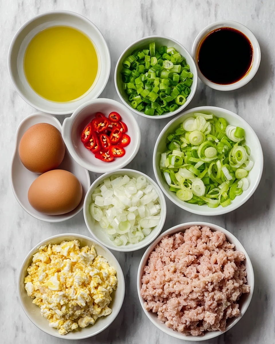 The image shows a collection of ingredients in white bowls and two brown eggs placed on a white marbled surface. Starting from the top left, there is a bowl filled with golden yellow oil, followed by a bowl of bright green chopped scallions to the right. Next to these is a pair of brown eggs lying side by side. Below the oil bowl is a small bowl containing thin red chili slices with visible seeds, and next to it is a bowl with dark soy sauce. Below the chili slices, there is a bowl with chopped white onions. Under the two bowls with sauce, there is a chunkier mixture of light and pale yellow chopped boiled eggs in a bowl. To the lower left is a bowl filled with finely sliced green onions, and directly to the right of it is a larger bowl filled with ground light pink meat. The white marbled surface serves as a clean, bright background for the arranged ingredients. Photo taken with an iphone --ar 4:5 --v 7